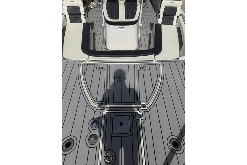 Slide: The Image of 2024 Tidewater 3100 Carolina Bay boat deck with seating and storage compartments. - 23