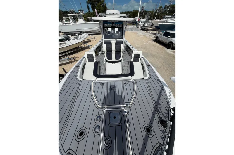 Slide: The Image of 2024 Tidewater 3100 Carolina Bay boat with sleek deck design and modern features. - 24