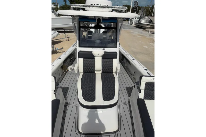 Slide: The Image of 2024 Tidewater 3100 Carolina Bay boat interior with sleek seating and modern design. - 25