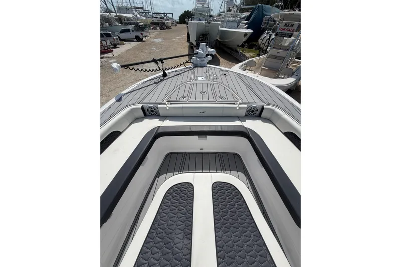 Slide: The Image of 2024 Tidewater 3100 Carolina Bay boat interior with sleek deck design and spacious seating. - 28