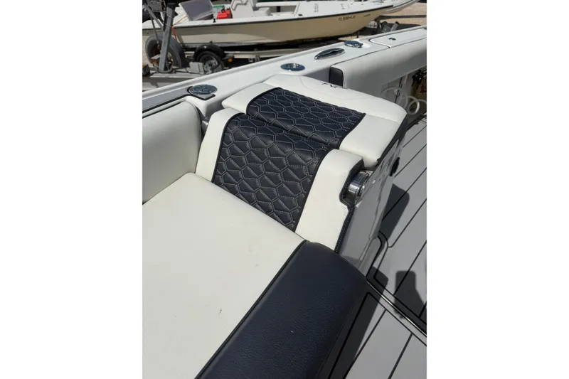 Slide: The Image of 2024 Tidewater 3100 Carolina Bay boat seat with stylish black and white upholstery. - 31