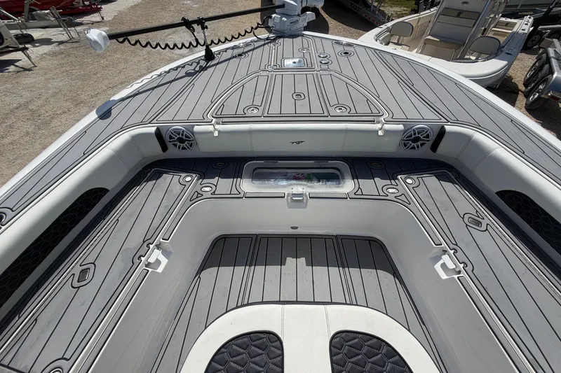 Slide: The Image of 2024 Tidewater 3100 Carolina Bay boat interior with sleek gray decking and seating. - 32