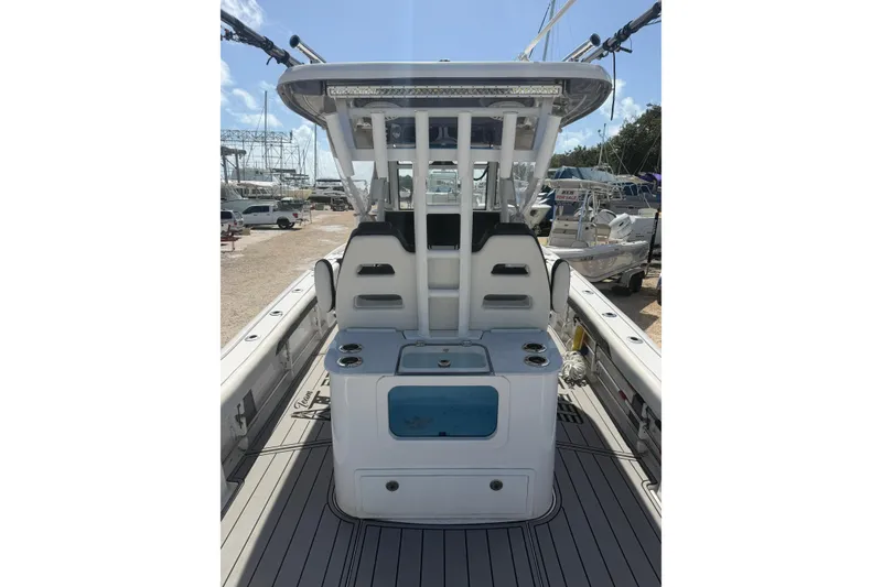 Slide: The Image of 2024 Tidewater 3100 Carolina Bay boat interior with seating and storage compartments. - 9