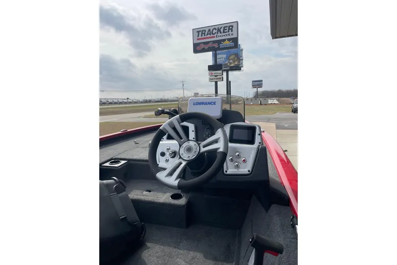 Slide: The Image of 2026 Tracker Pro Team 195 boat interior with steering wheel and control panel. - 4
