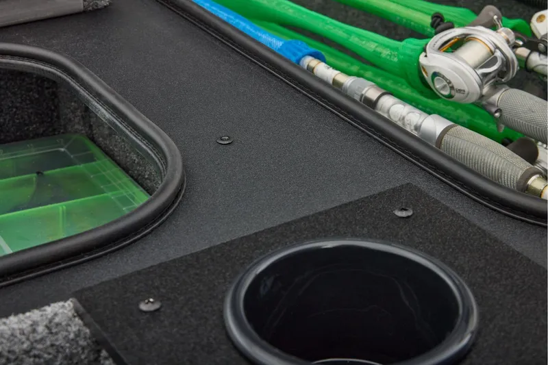 Slide: The Image of Manufacturer Provided Image: 2026 Tracker Pro Team 195 boat interior with fishing rods and tackle storage. - 40