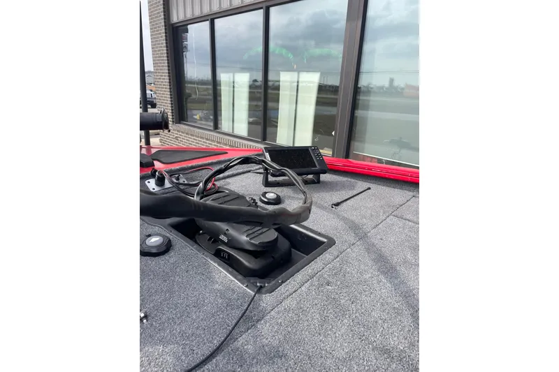 Slide: The Image of 2026 Tracker Pro Team 195 boat interior with steering wheel and control panel. - 8