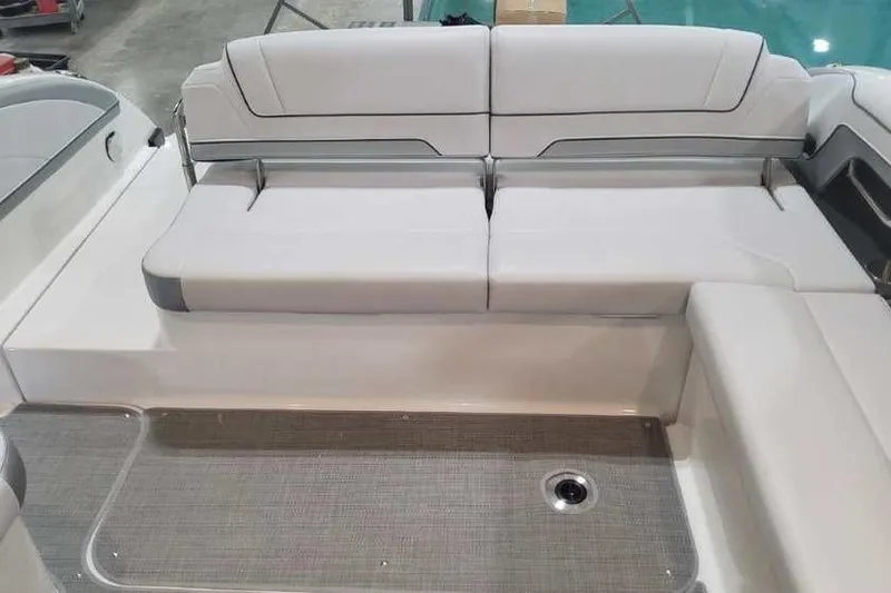 Slide: The Image of 2024 Formula 330 Crossover Bowrider I/O interior seating area with sleek white upholstery. - 13