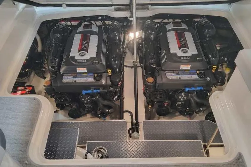 Slide: The Image of 2024 Formula 330 Crossover Bowrider I/O engine compartment with dual engines. - 15