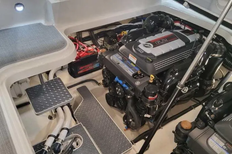 Slide: The Image of Engine compartment of 2024 Formula 330 Crossover Bowrider I/O, showcasing powerful 6.2L engine. - 16