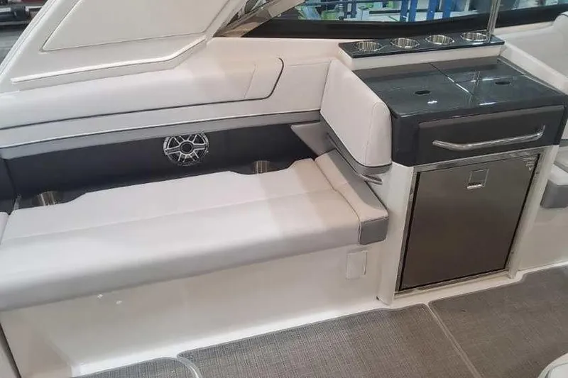 Slide: The Image of 2024 Formula 330 Crossover Bowrider I/O interior with seating and kitchenette area. - 18