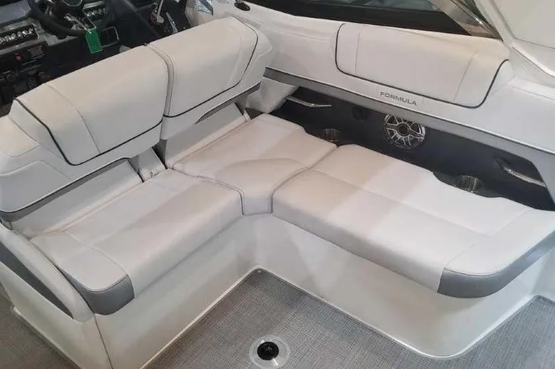 Slide: The Image of 2024 Formula 330 Crossover Bowrider I/O interior with plush seating and modern design. - 21