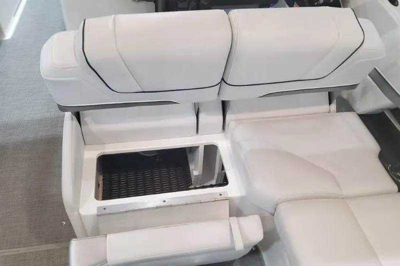 Slide: The Image of 2024 Formula 330 Crossover Bowrider I/O interior seating with storage compartment. - 23