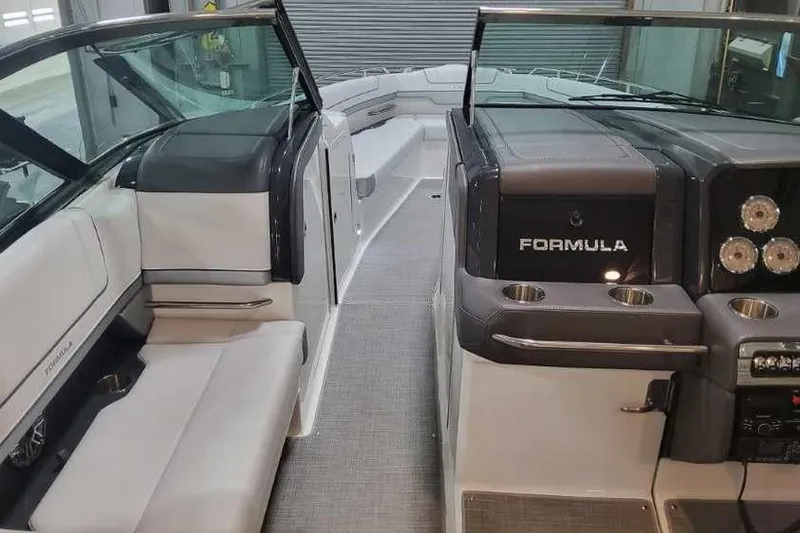 Slide: The Image of 2024 Formula 330 Crossover Bowrider I/O interior with sleek seating and modern dashboard. - 28