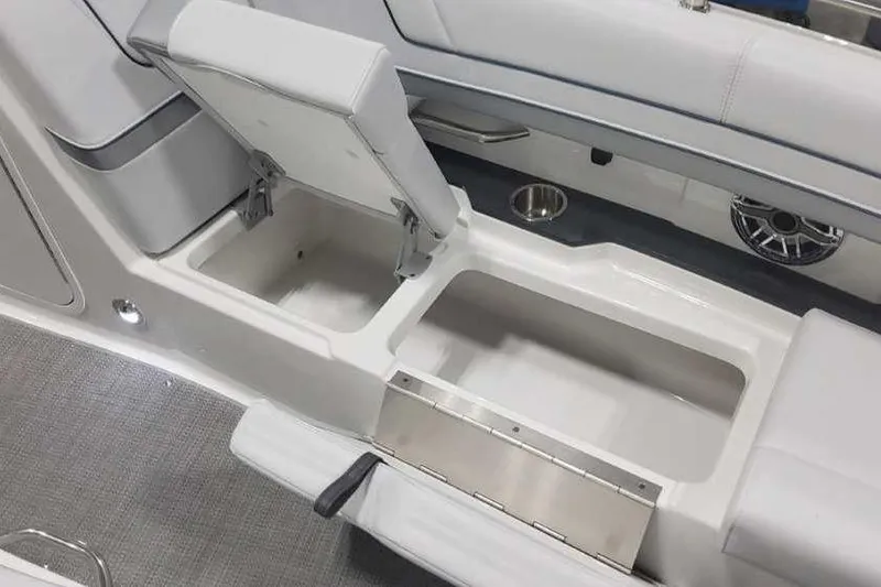 Slide: The Image of 2024 Formula 330 Crossover Bowrider I/O interior storage compartment with sleek seating design. - 34