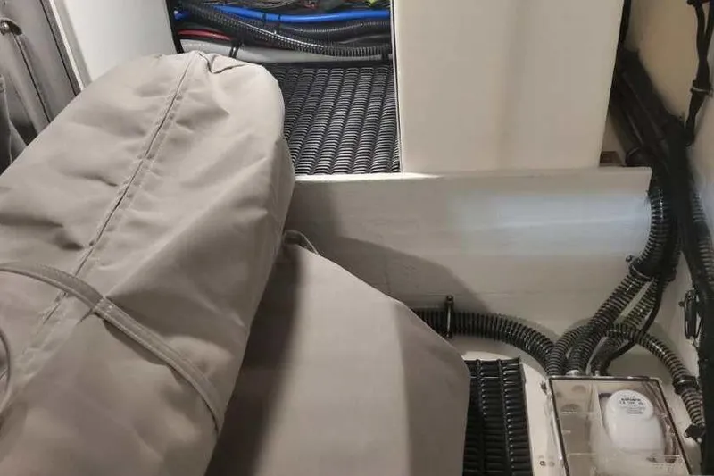 Slide: The Image of 2024 Formula 330 Crossover Bowrider I/O interior with covered equipment and wiring. - 43