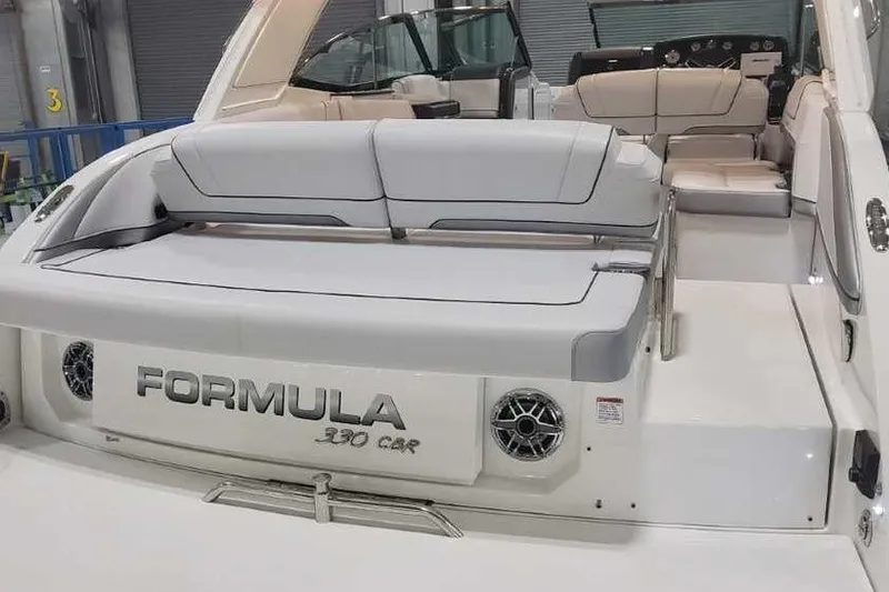 Slide: The Image of 2024 Formula 330 Crossover Bowrider I/O with spacious seating and sleek design. - 8