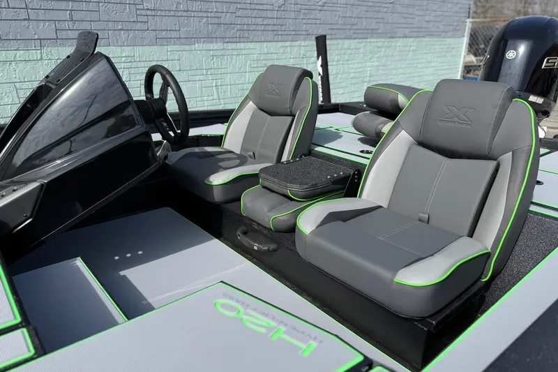 Slide: The Image of 2026 Xpress H20 Bass boat interior with sleek gray and green seating design. - 6