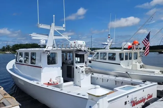 The Image of Northern Bay 36 Extended 38' Tuna rigged boat, rebuilt in 2023, docked with clear skies. - 0