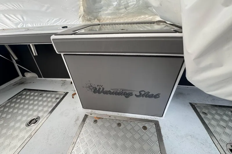 Slide: The Image of Interior of 2000 Northern Bay 38 boat with "Warning Shot" label on panel. - 27