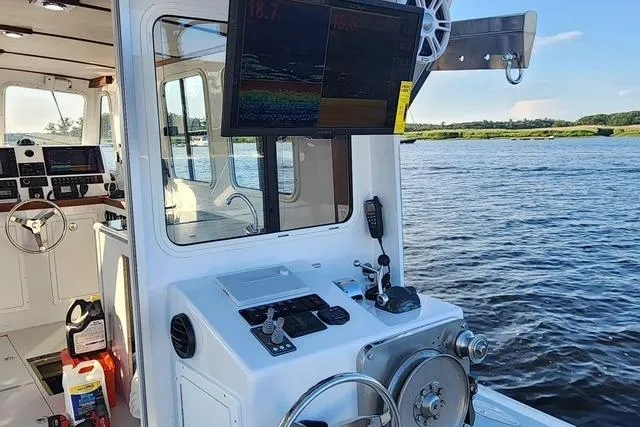 Slide: The Image of Northern Bay 36 Extended 38' Tuna rigged boat, rebuilt 2023, featuring modern navigation equipment. - 3