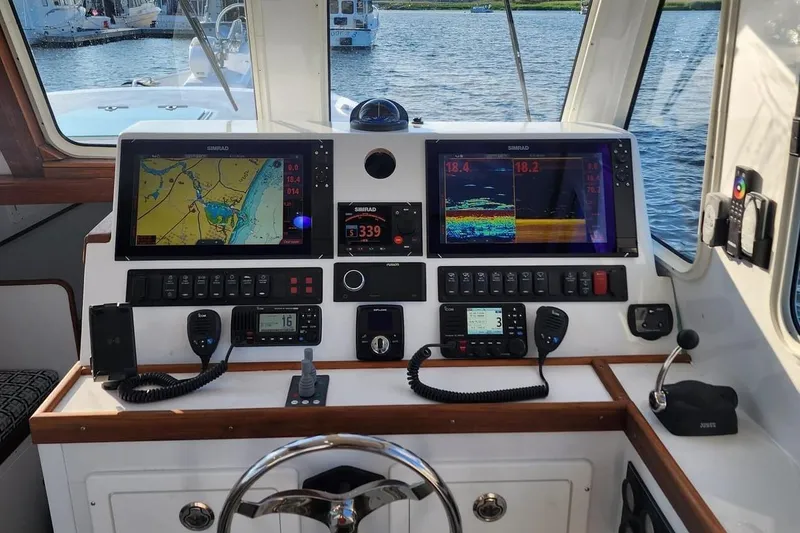 Slide: The Image of Northern Bay 36 Extended 38' Tuna rigged helm with navigation displays, rebuilt in 2023. - 4