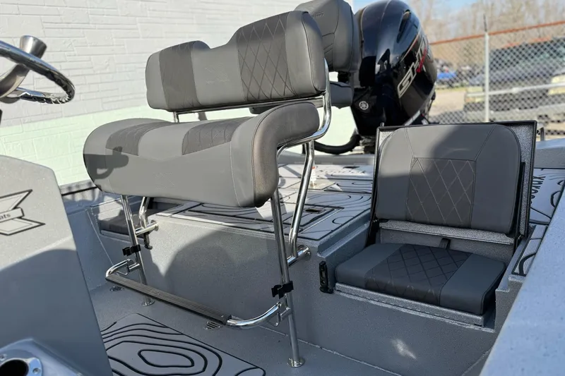 Slide: The Image of 2026 Xpress H22B Bay boat interior with cushioned seating and modern design. - 11