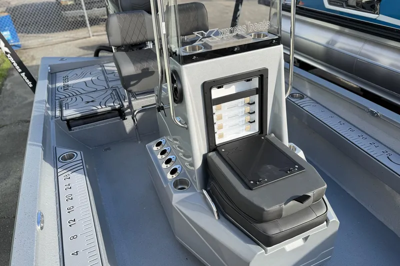 Slide: The Image of 2026 Xpress H22B Bay boat interior with seating and storage compartments. - 8