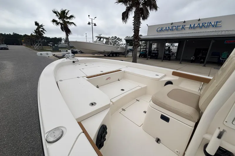 Slide: The Image of 2014 Pathfinder 2600 HPS boat at Grander Marine dealership, overcast day. - 3