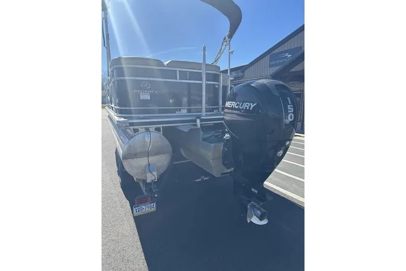 Slide: The Image of 2015 Regency 220 DL3 pontoon boat with Mercury 150 outboard motor. - 10