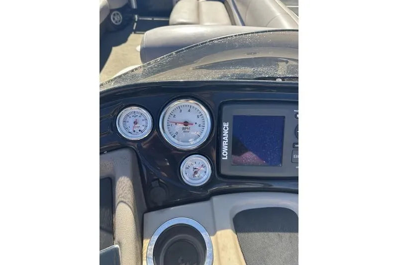 Slide: The Image of Dashboard of a 2015 Regency 220 DL3 boat with gauges and Lowrance display. - 15