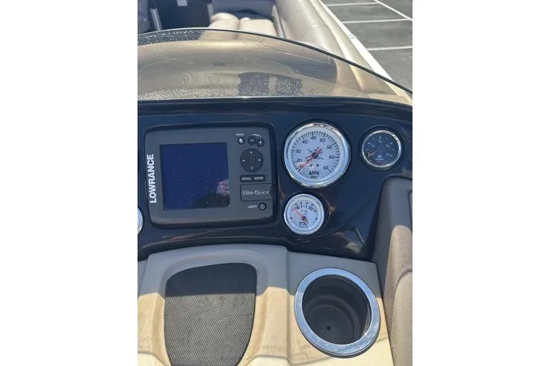 Slide: The Image of Dashboard of 2015 Regency 220 DL3 boat with Lowrance display and gauges. - 18