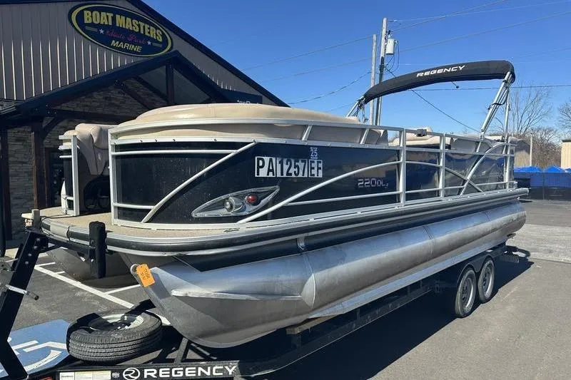Slide: The Image of 2015 Regency 220 DL3 pontoon boat on trailer at Boat Masters Marine. - 5