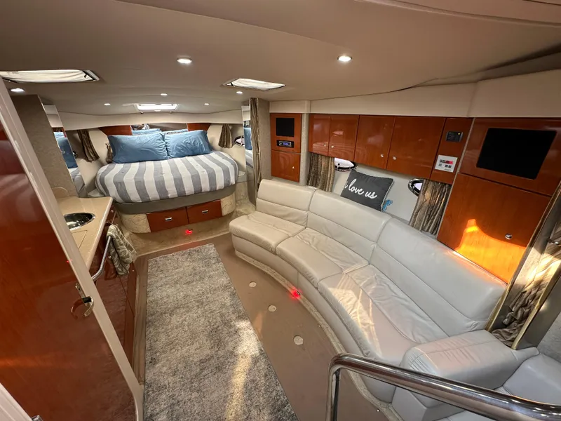 Slide: The Image of Luxurious interior of a 2004 Formula 34 PC yacht with cozy seating and elegant decor. - 14