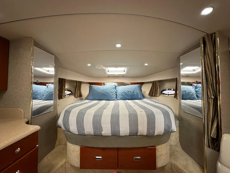 Slide: The Image of Luxurious 2004 Formula 34 PC cabin with cozy bed and elegant interior design. - 20