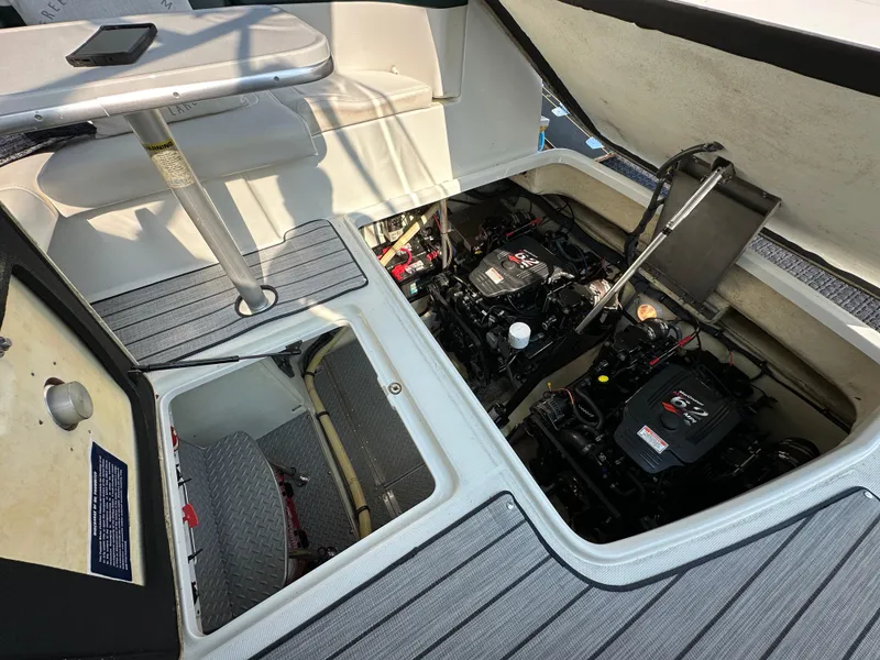 Slide: The Image of 2004 Formula 34 PC boat engine compartment with open hatch, revealing dual engines. - 28