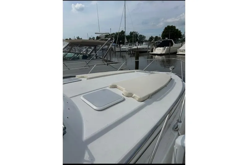 Slide: The Image of 2004 Formula 34 Performance Cruiser docked at marina, featuring sleek deck design. - 3