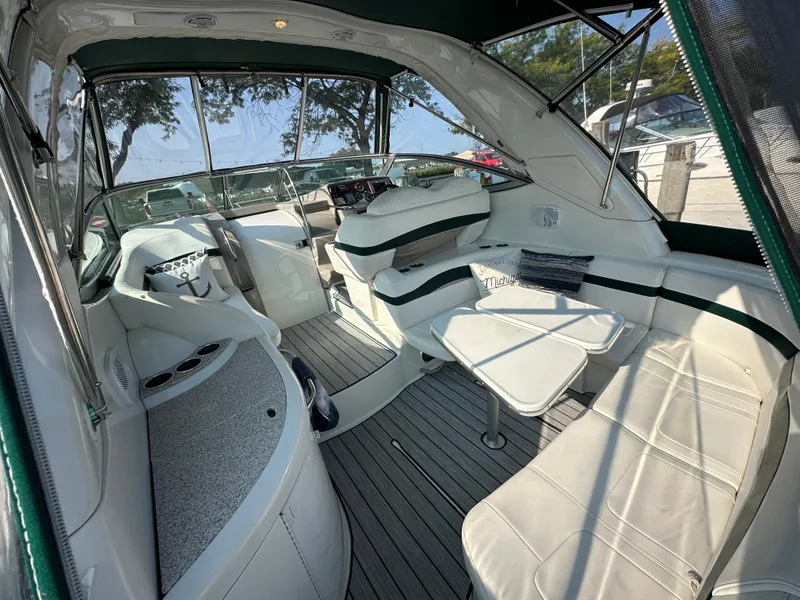 Slide: The Image of 2004 Formula 34 PC yacht interior with white seating and modern helm. - 4