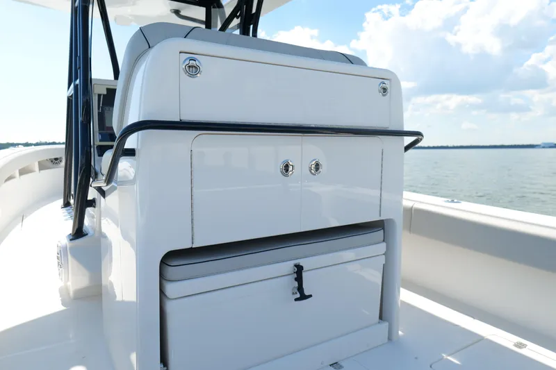 Slide: The Image of 2023 SeaVee 32 boat interior with storage compartment and ocean view. - 12