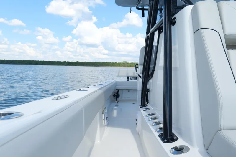 Slide: The Image of 2023 SeaVee 32 boat interior with sleek design on calm water. - 26