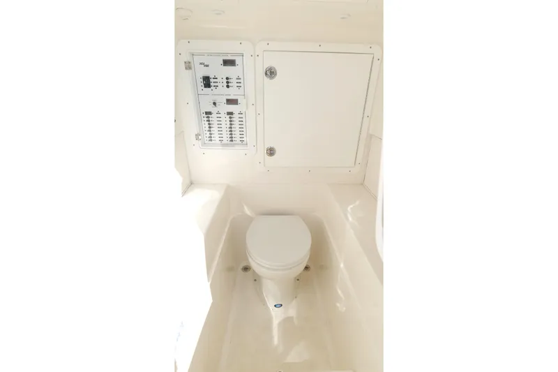 Slide: The Image of 2023 SeaVee 32 boat interior with toilet and control panel. - 32