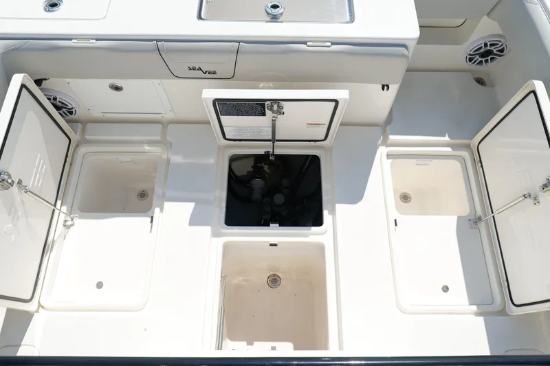 Slide: The Image of 2023 SeaVee 32 boat deck with open storage compartments and clean design. - 37