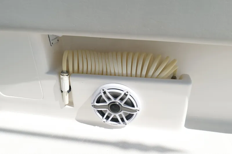 Slide: The Image of 2023 SeaVee 32 boat detail showing speaker and coiled hose storage. - 41