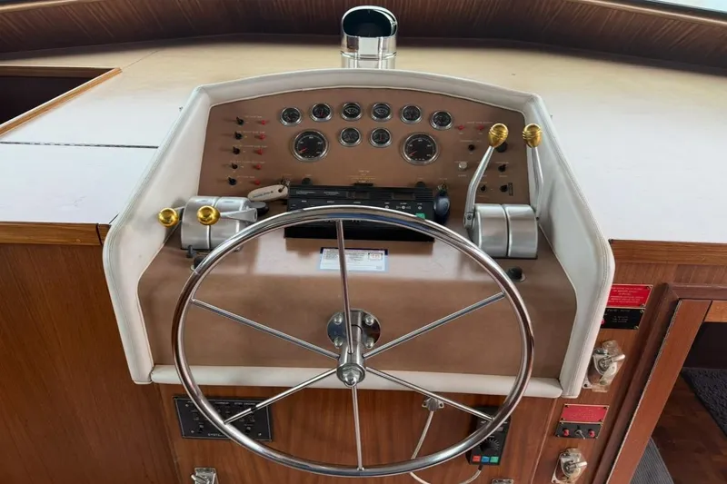 Slide: The Image of Modern kitchen in 1987 Hatteras 54 Motor Yacht with stainless appliances and mosaic backsplash. - 12