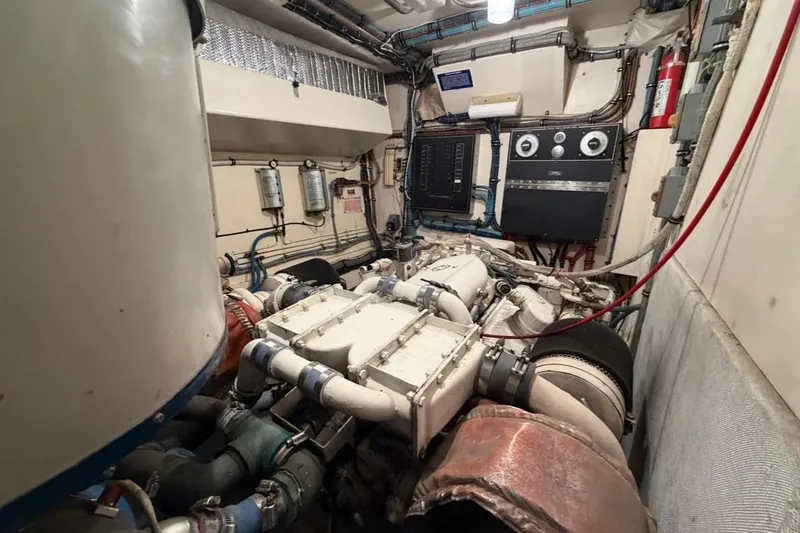 Slide: The Image of 1987 Hatteras 54 Motor Yacht kitchen with stainless steel fridge and sink. - 13