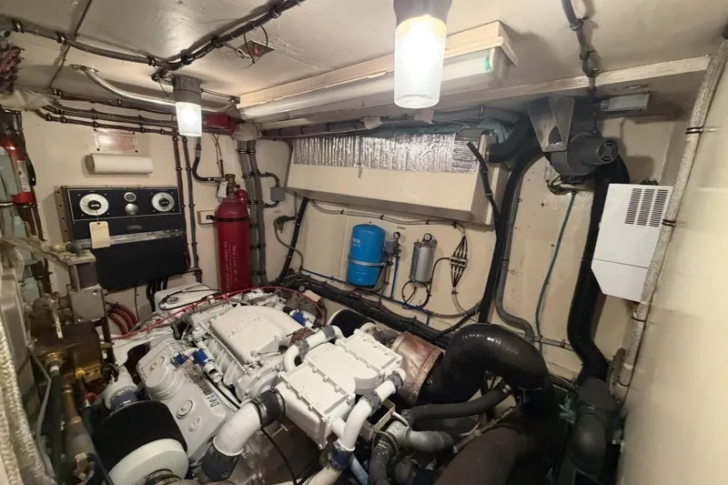 Slide: The Image of 1987 Hatteras 54 Motor Yacht cabin with bunk beds and wooden interior. - 14