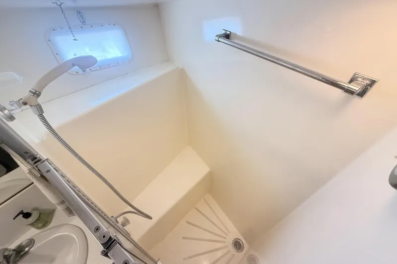 Slide: The Image of Shower area in 1987 Hatteras 54 Motor Yacht with handheld showerhead and grab bar. - 17