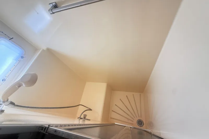 Slide: The Image of Shower area in 1987 Hatteras 54 Motor Yacht with handheld showerhead and window. - 27