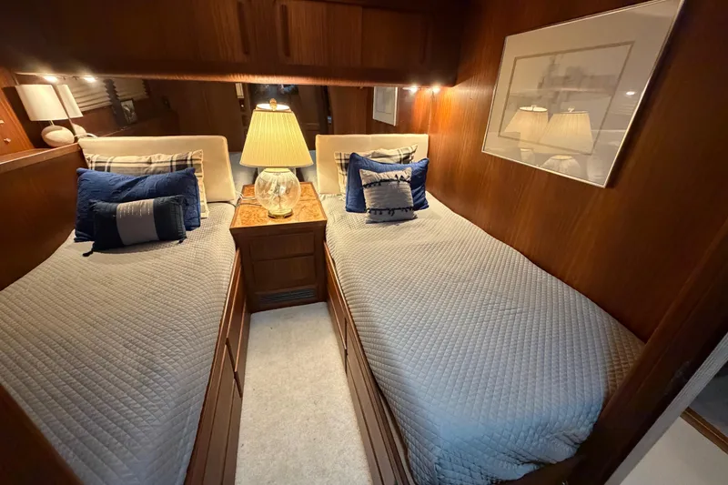 Slide: The Image of Twin beds in a cozy cabin of a 1987 Hatteras 54 Motor Yacht. - 51