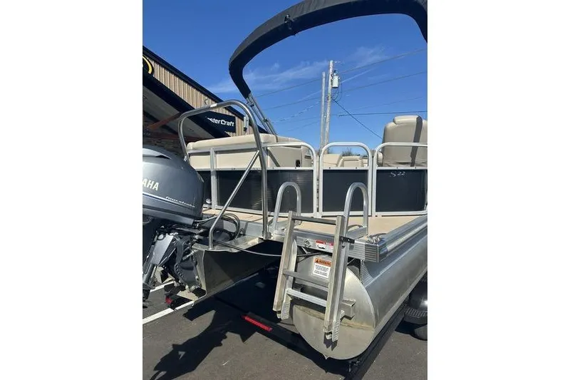 Slide: The Image of 2015 Bennington 22 SLX pontoon boat with Yamaha motor and boarding ladder. - 11