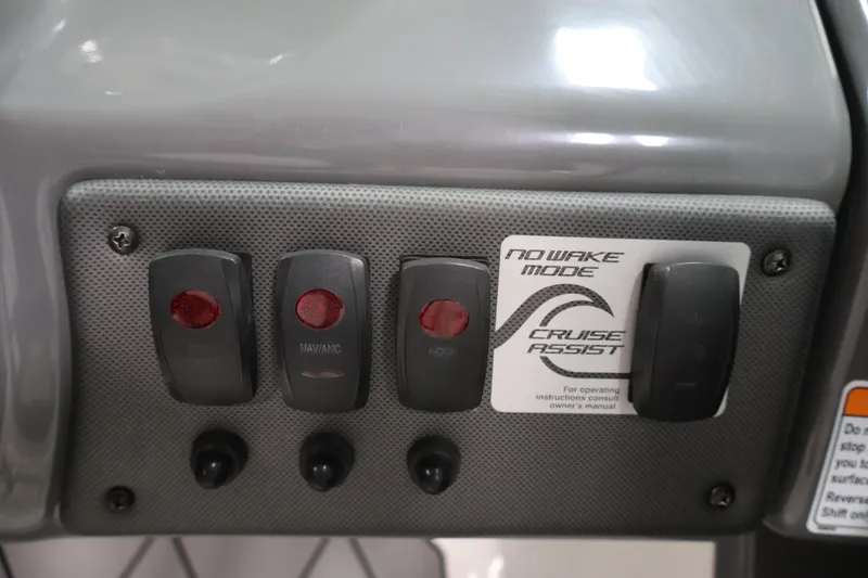 Slide: The Image of 2016 Yamaha SX190 boat control panel with switches and Cruise Assist feature. - 16